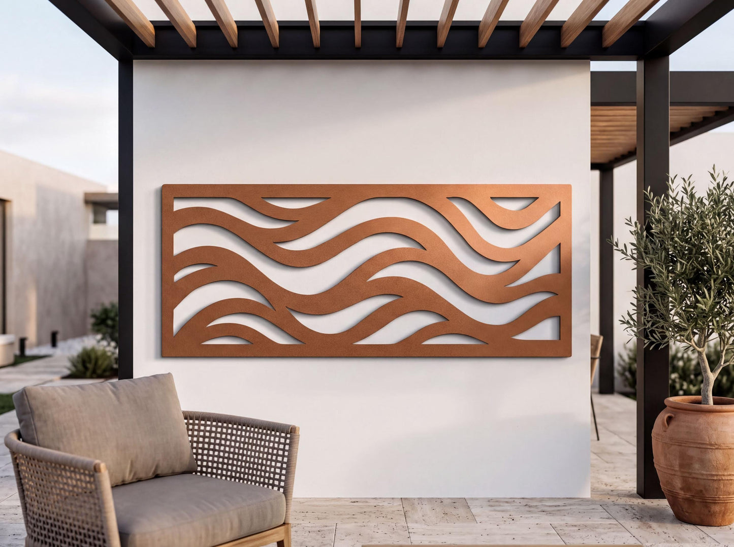 a modern outdoor patio with a wavy metal wall art piece hanging on the wall, a woven chair, and a potted plant.