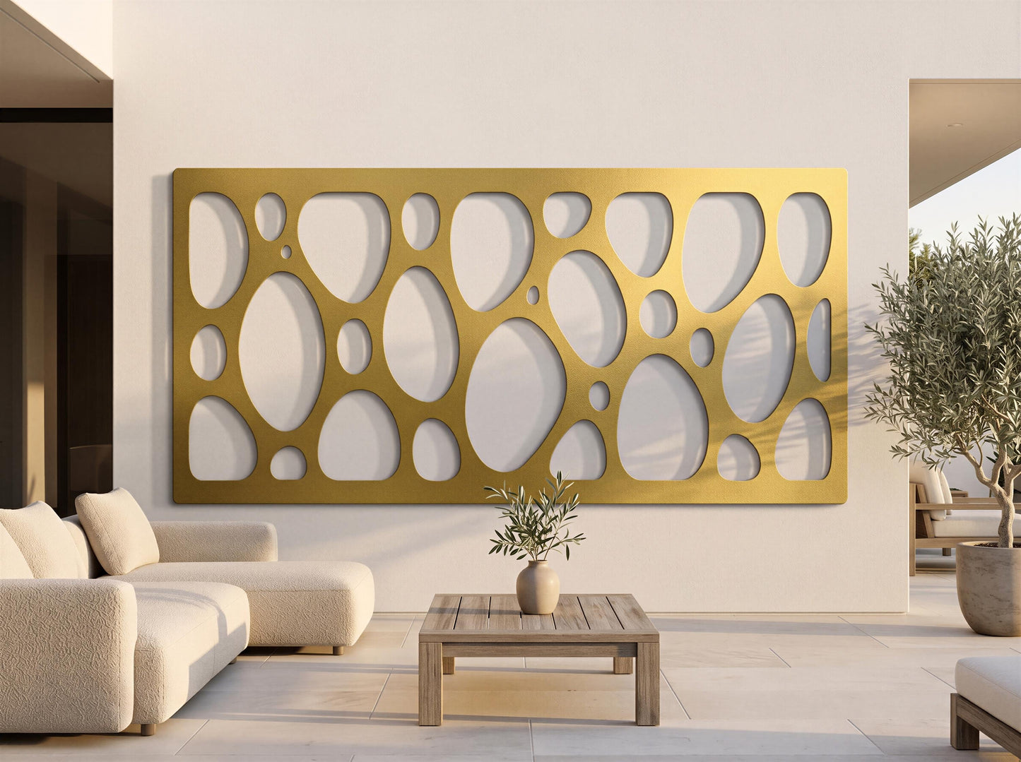 a modern living room with a large, gold-colored geometric wall panel as the focal point. The room is furnished with a sofa, a coffee table, and a potted plant, creating a cozy and stylish atmosphere.