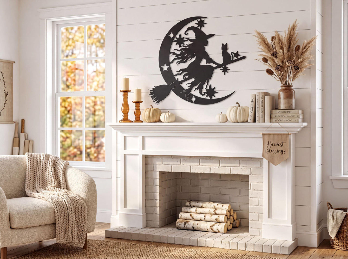 a cozy living room with a fireplace, a white mantel, and a witch silhouette on the wall. The room is decorated with fall-themed elements, such as a vase of dried flowers and a stack of books. The overall atmosphere is warm and inviting, with a touch of rustic charm from the fireplace and the autumnal decor.
