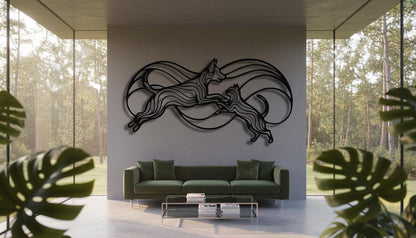 a modern living room with a large wall art piece depicting two dogs in mid-leap, surrounded by a circular pattern. The room is furnished with a green sofa and a glass coffee table, and the space is illuminated by natural light coming through large windows overlooking a forested area.