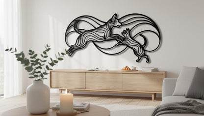 a modern living room with a large black metal wall art depicting a stylized cat or feline figure. The room is furnished with a couch, a coffee table, and a wooden cabinet. There is also a potted plant and a candle on the coffee table, adding to the cozy and inviting atmosphere of the space.