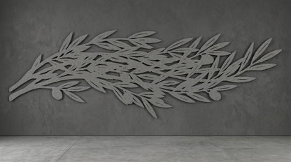 a large, abstract leaf-like design on a grey wall.