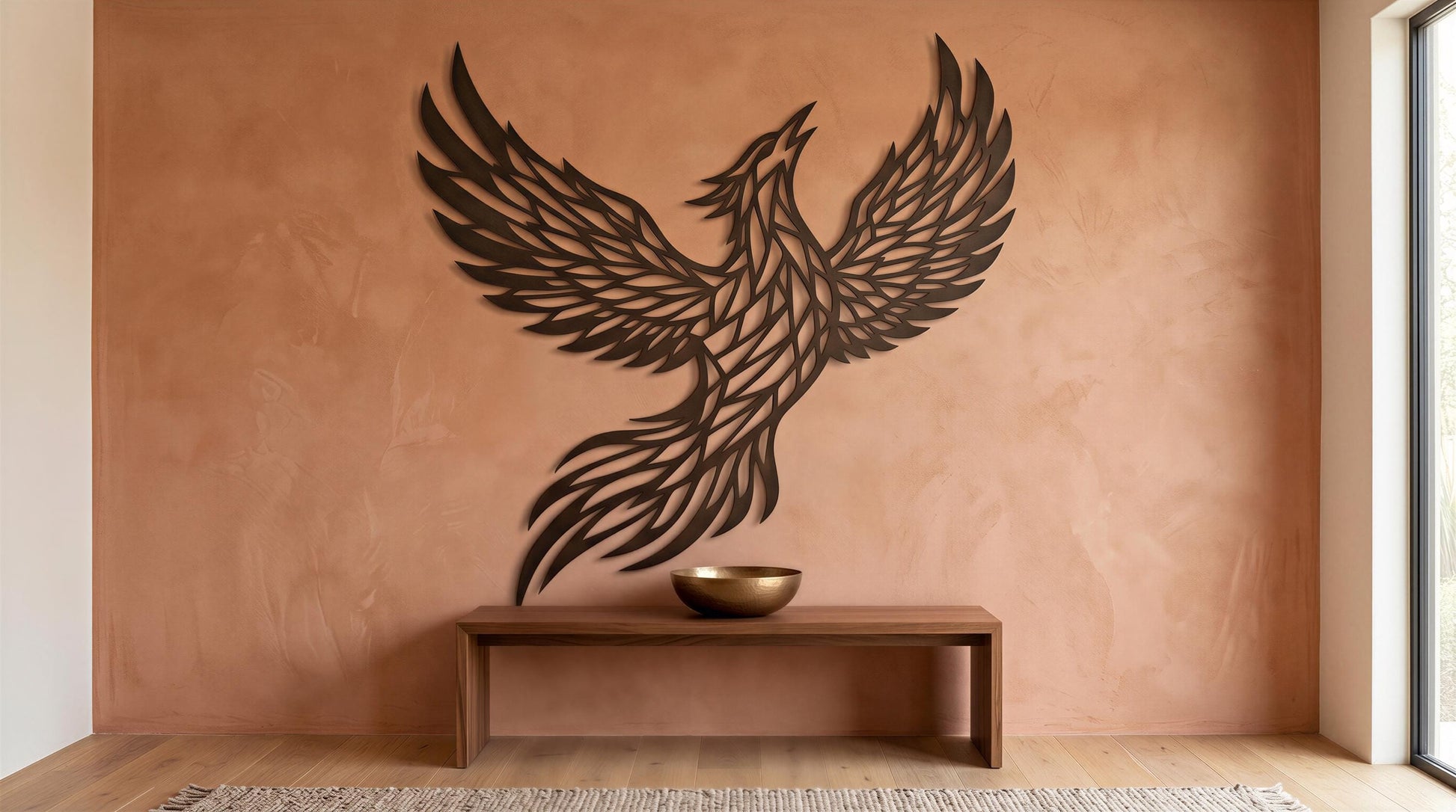 a wooden bench with a bowl on it, set against a peach-colored wall with a large, stylized bird sculpture or artwork hanging above it.