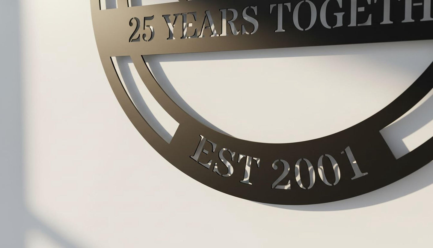 a black metal sign with the text "25 YEARS TOGETHER EST 2001" engraved on it.