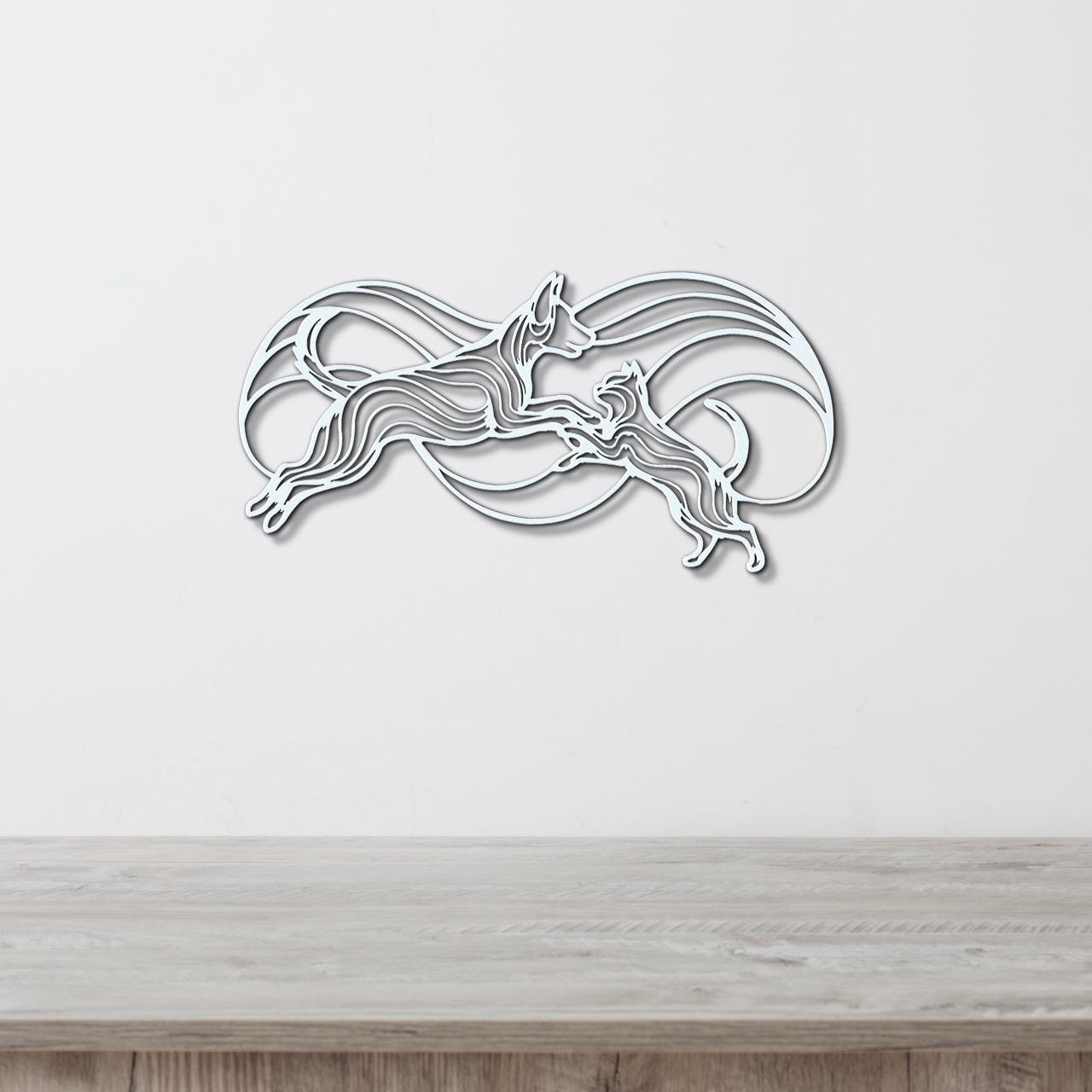 A decorative wall art piece depicting a stylized dog silhouette in mid-leap, with a wave-like pattern behind it, mounted on a white wall above a wooden surface.