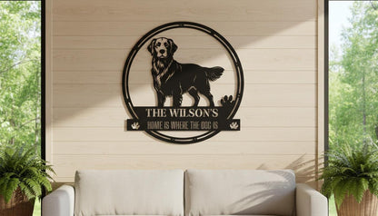 A wall-mounted sign featuring a black and white illustration of a dog, with the text "The Wilson's HOME IS WHERE THE DOG IS" below it.