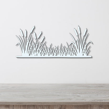 A white wall with a wooden shelf or table in front of it.