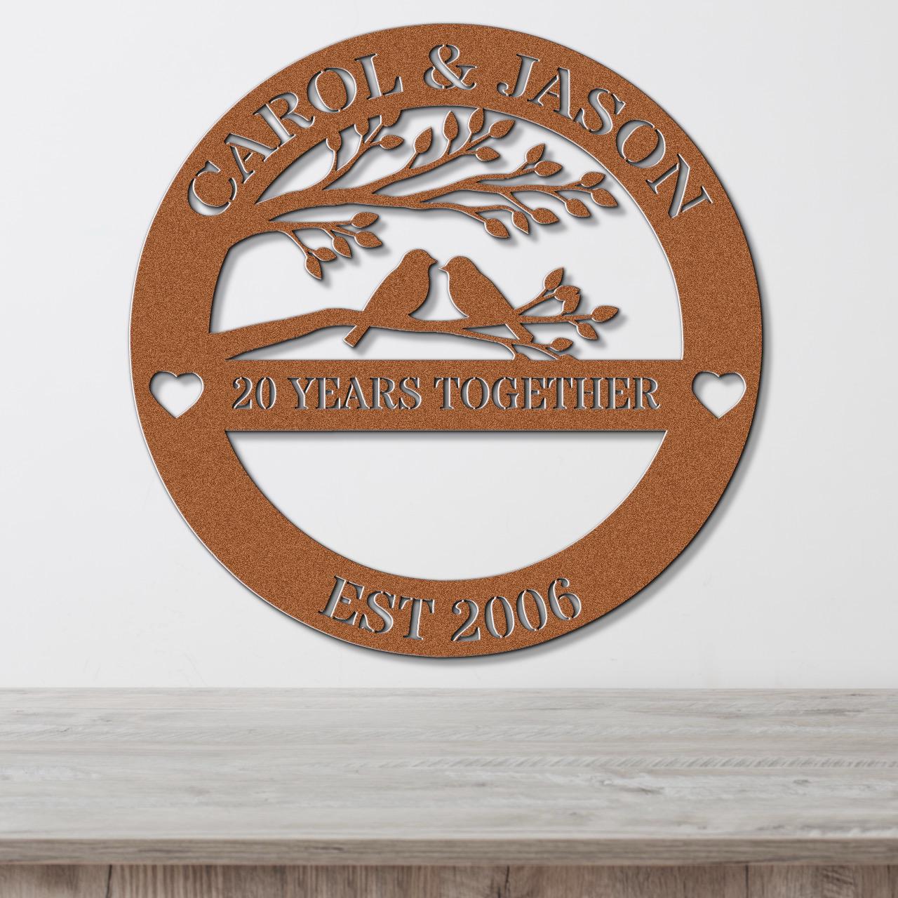 a circular metal sign with the text "CAROL & JASON" and "20 YEARS TOGETHER" on it, along with the year "EST 2006" below it.