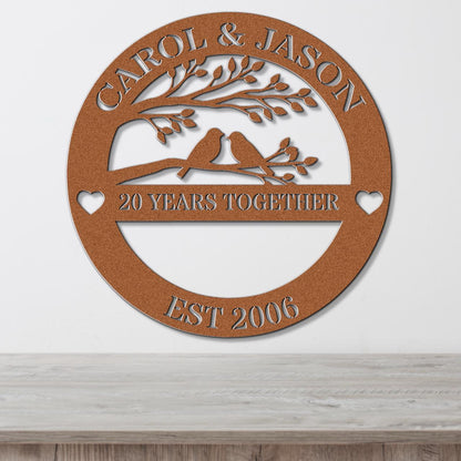 a circular metal sign with the text "CAROL & JASON" and "20 YEARS TOGETHER" on it, along with the year "EST 2006" below it.