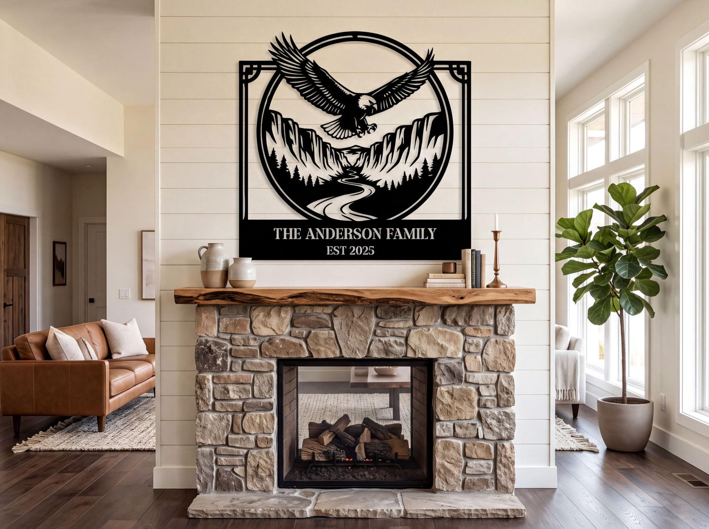 a living room with a stone fireplace, a wooden mantel, and a large metal sign above the fireplace that says "The Anderson Family EST 2015".