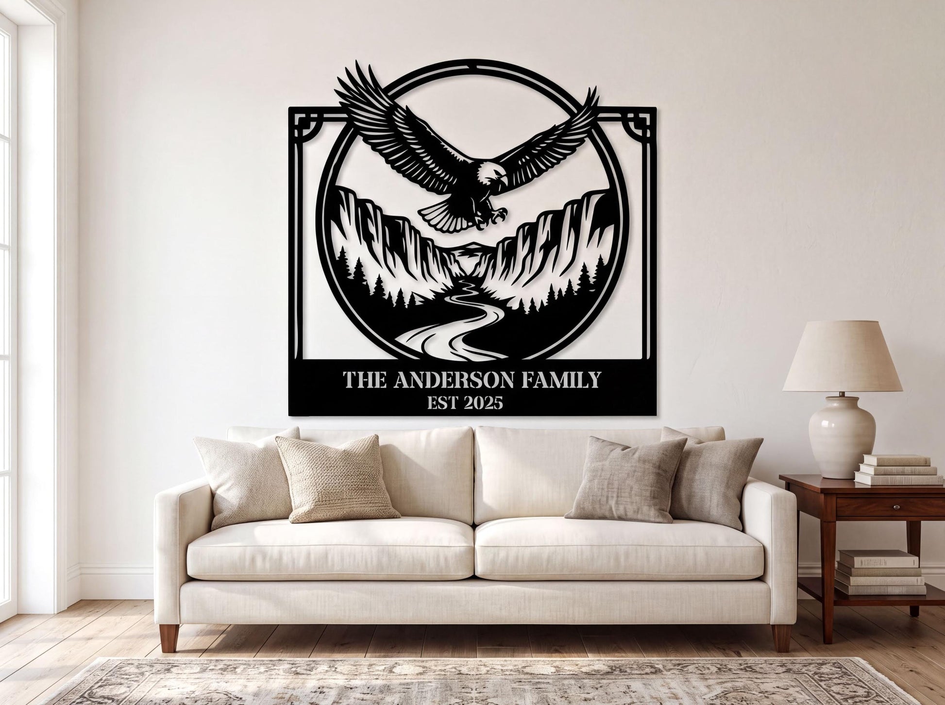 a large black and white metal wall art depicting an eagle in flight above a mountain landscape, with the text "THE ANDERSON FAMILY EST. 2015" below the artwork.
