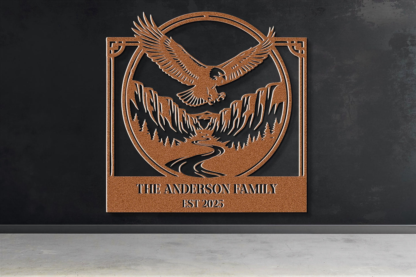a large metal sign with an eagle and mountains in the background, mounted on a wall.