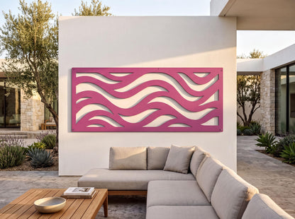 a modern outdoor living space with a large, colorful wavy wall art piece as the focal point. The space includes a comfortable gray sectional sofa, a wooden coffee table, and a few potted plants, creating a cozy and inviting atmosphere.