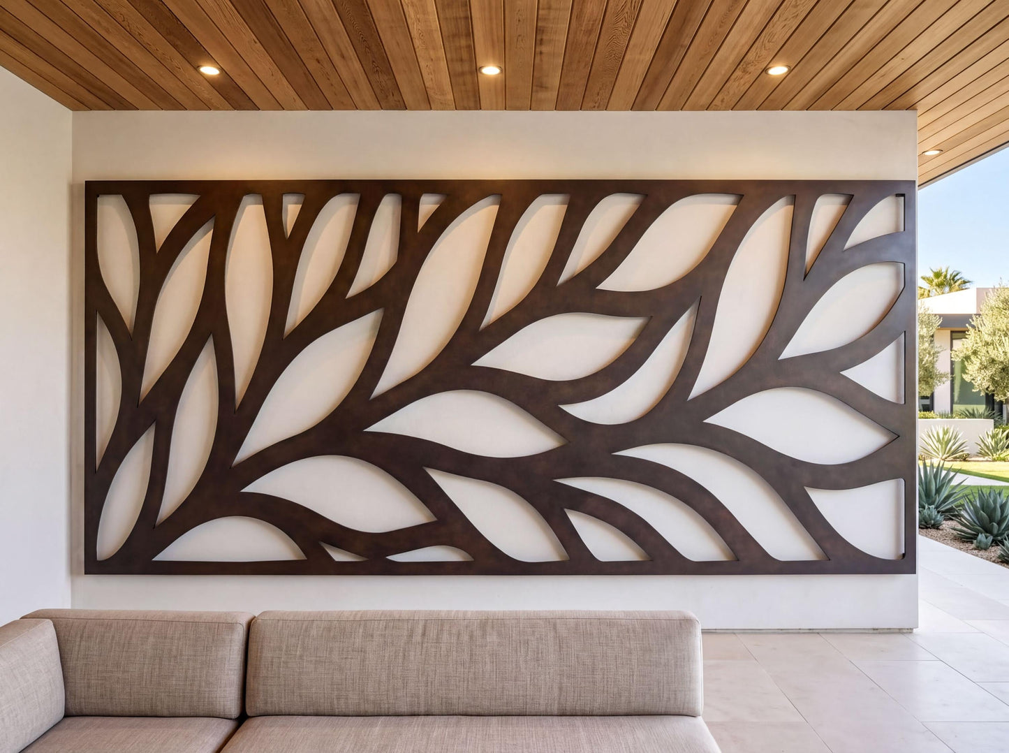 a modern living room with a large, abstract wall art piece composed of curved lines and shapes in a dark color. In the foreground, there is a beige sofa, and the room has a wooden ceiling with recessed lighting.