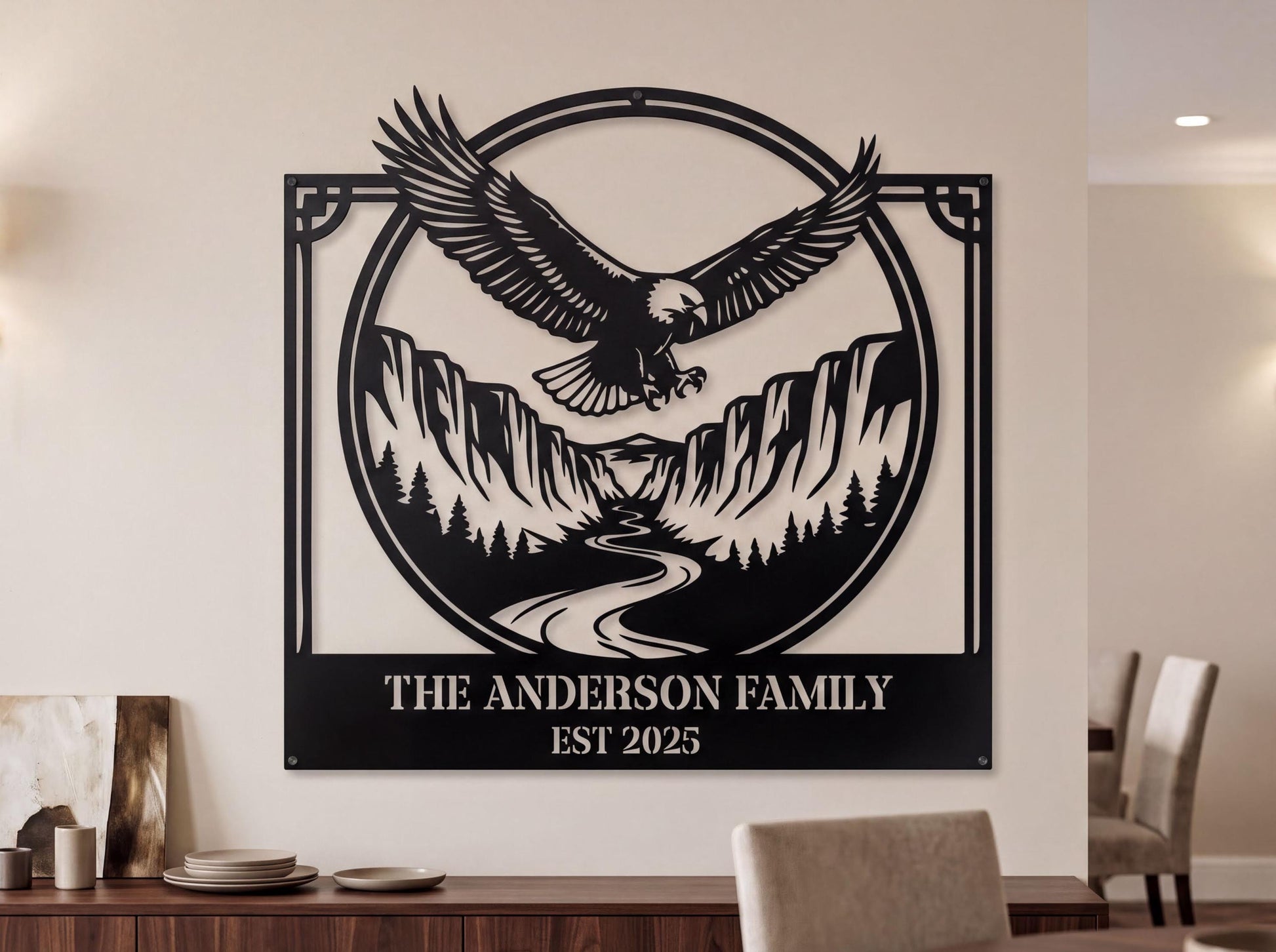 a large metal sign with a black eagle in flight and a mountain landscape in the background. The sign is mounted on a wall above a wooden table with chairs.