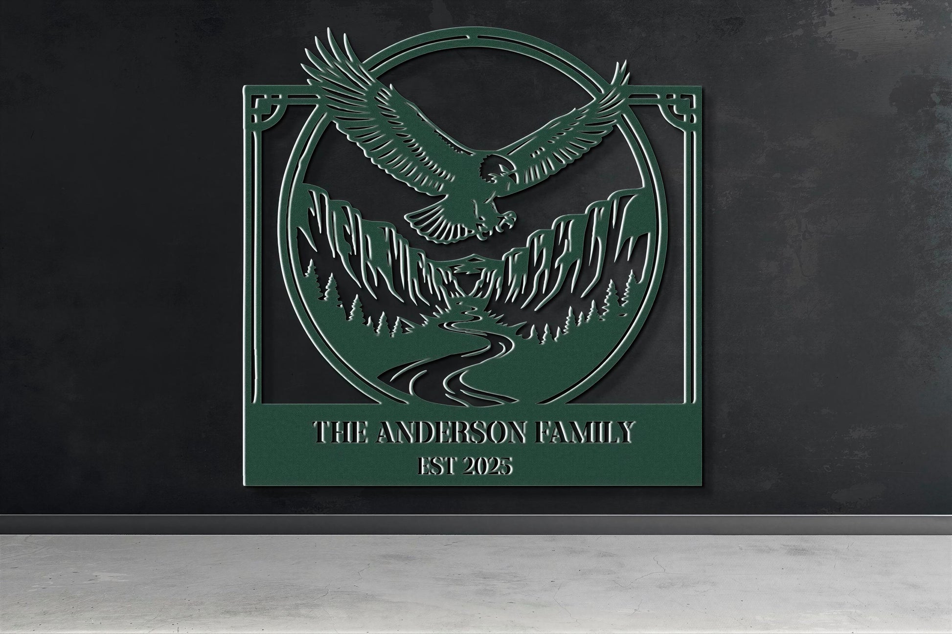 a green metal sign with an eagle and mountains in the background, mounted on a wall.