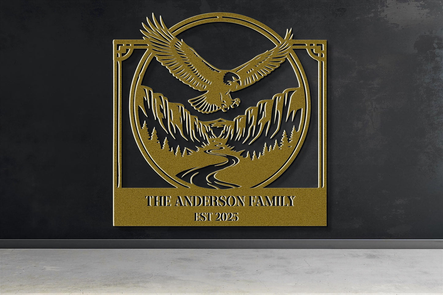 a gold-colored metal plaque with a stylized eagle and mountain landscape design.