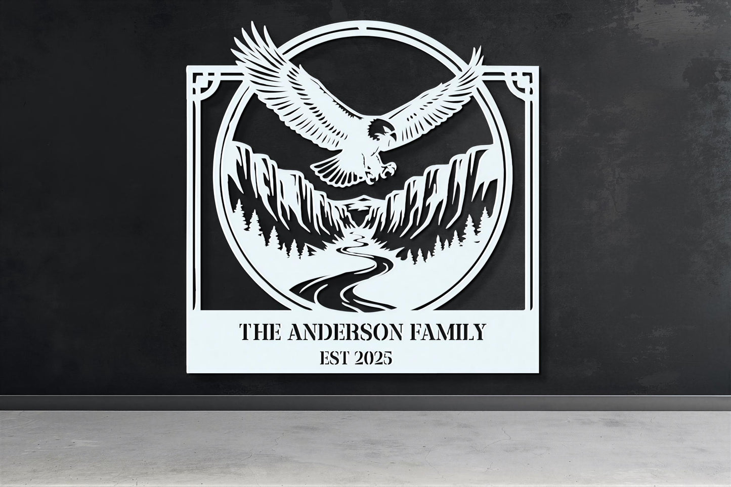 a large white sign with a black eagle and mountains in the background, mounted on a wall.