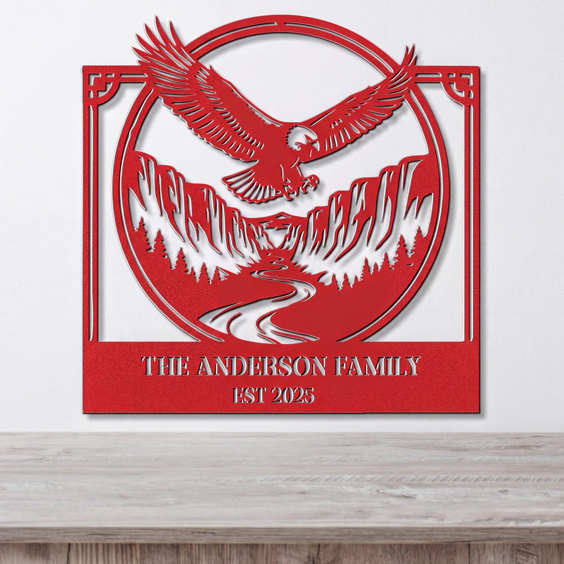 a red metal sign with a stylized eagle and mountain landscape design.