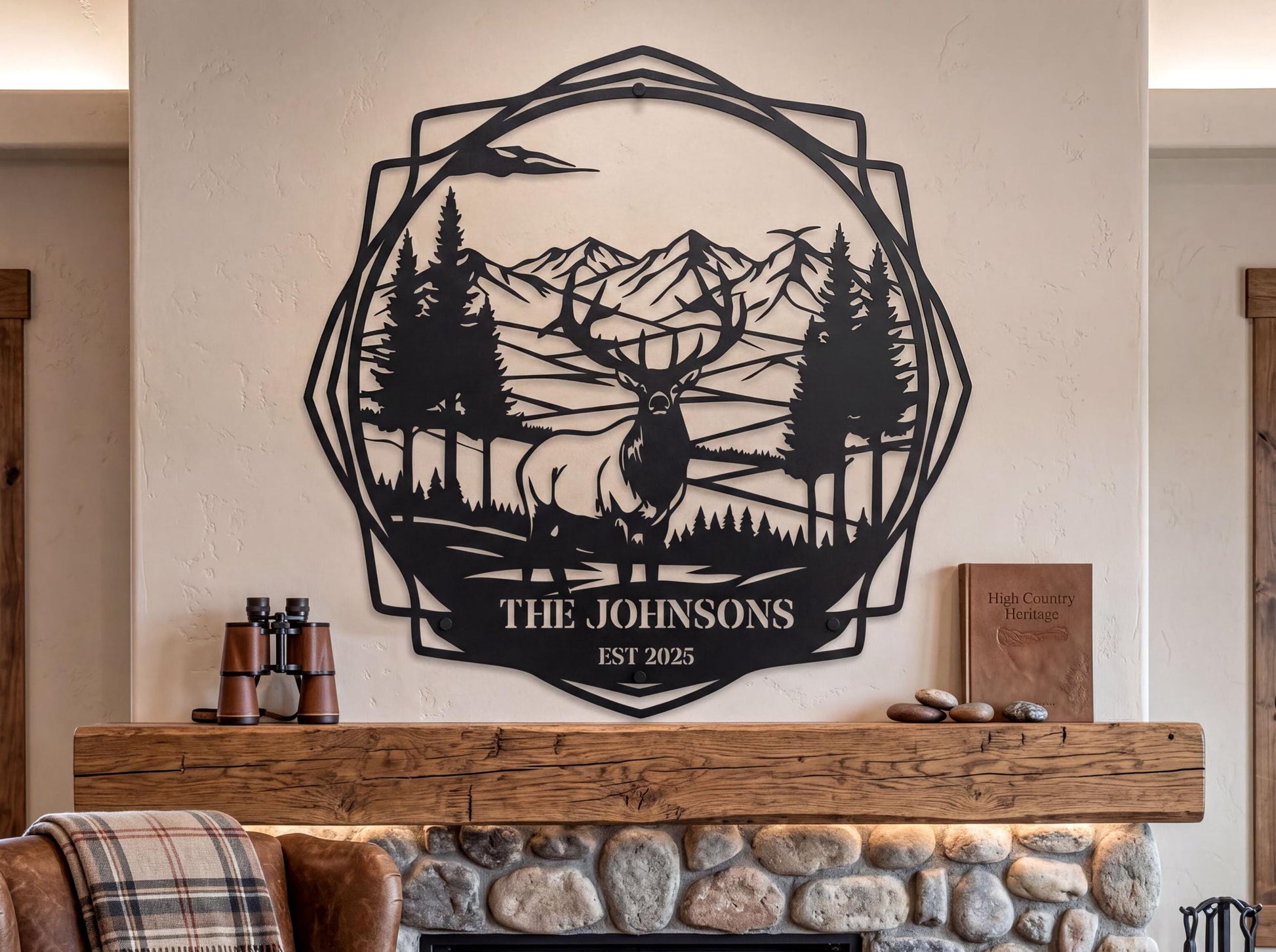 a wall art piece depicting a deer in a forest setting, with mountains in the background. The art piece is mounted above a wooden mantel with a stone fireplace.