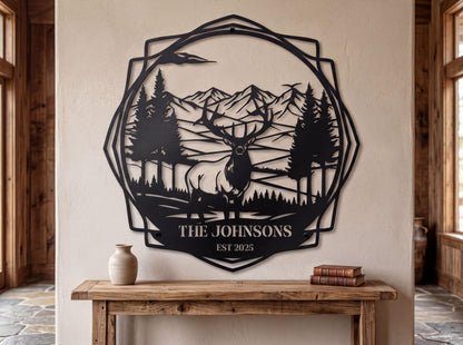 a wall art piece depicting a deer in a forest setting, with mountains in the background. The wall art is titled "THE JOHNSONS" and is displayed on a wall above a wooden table.