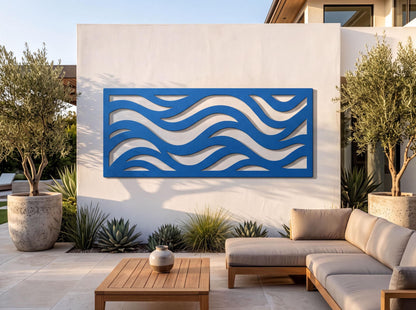 a modern outdoor living space with a large blue wave-shaped wall art piece, a wooden table, and a comfortable sofa.