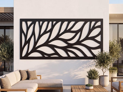 a modern outdoor living space with a large black and white leaf-like design on the wall behind a seating area. The seating area includes a couch and a coffee table, and there are potted plants and a wooden table nearby.