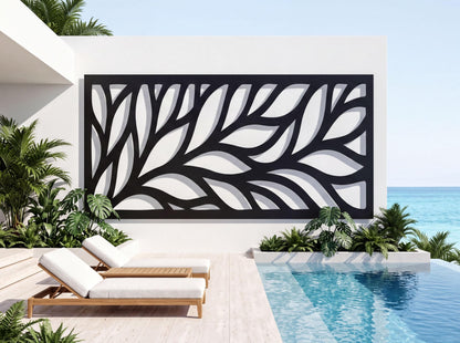 a modern outdoor pool area with a large black and white leaf-like design on the wall behind it, creating a striking visual contrast. The pool area is furnished with two white lounge chairs, and the scene is surrounded by lush tropical plants, including palm trees, which add to the serene and relaxing atmosphere.