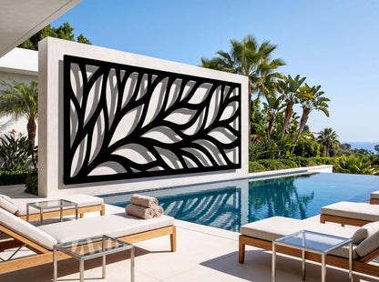 a modern outdoor pool area with a large black and white leaf-like design on the wall behind it, surrounded by comfortable lounge chairs and a glass table.