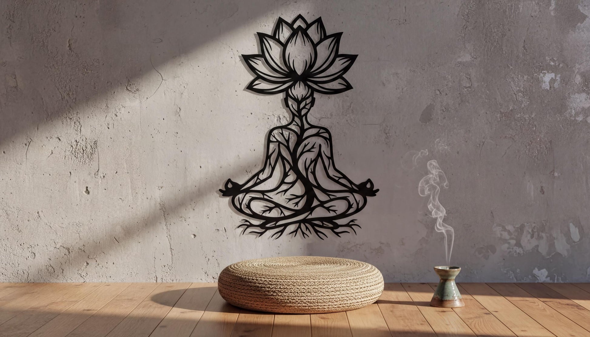 a minimalist design with a stylized lotus flower and a person in a meditative pose, both depicted on a concrete wall. In front of the wall, there is a woven stool and a small incense burner, creating a serene and tranquil atmosphere.