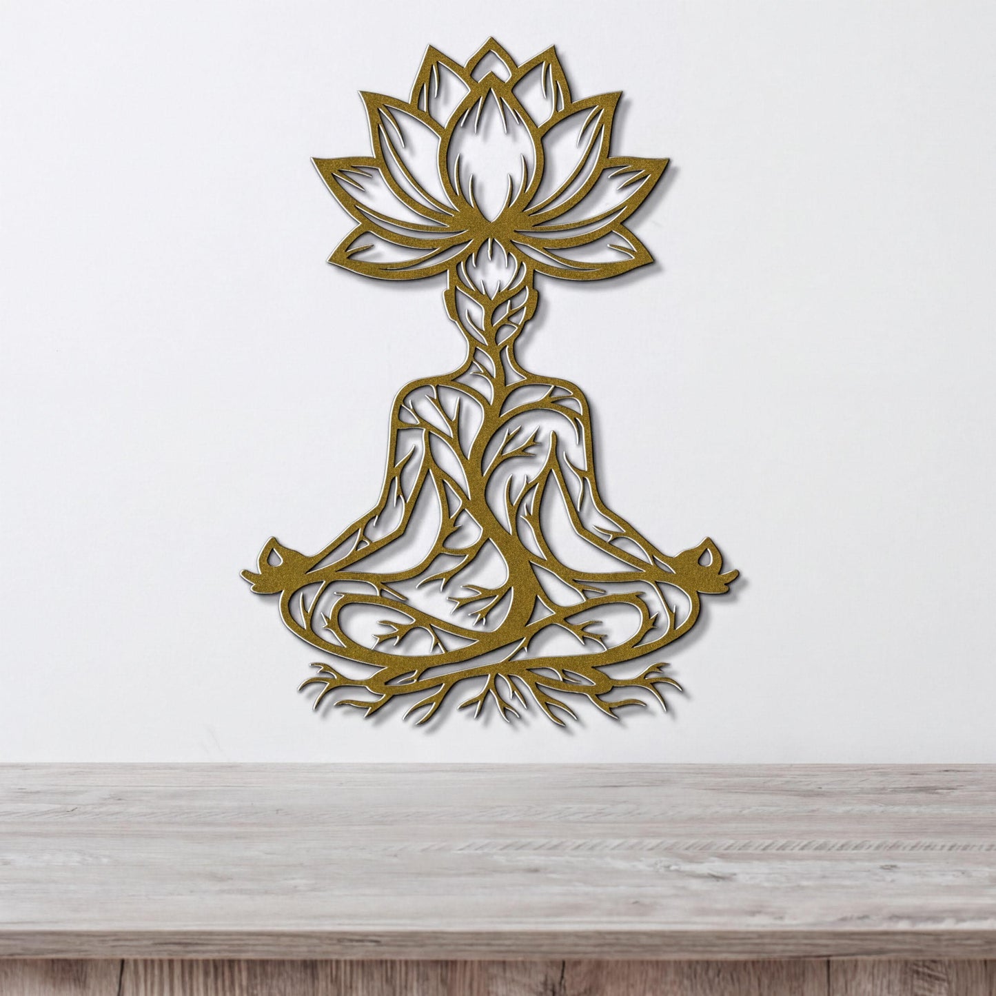 A wall art piece depicting a stylized figure in a meditative pose, with intricate tree-like patterns surrounding it.