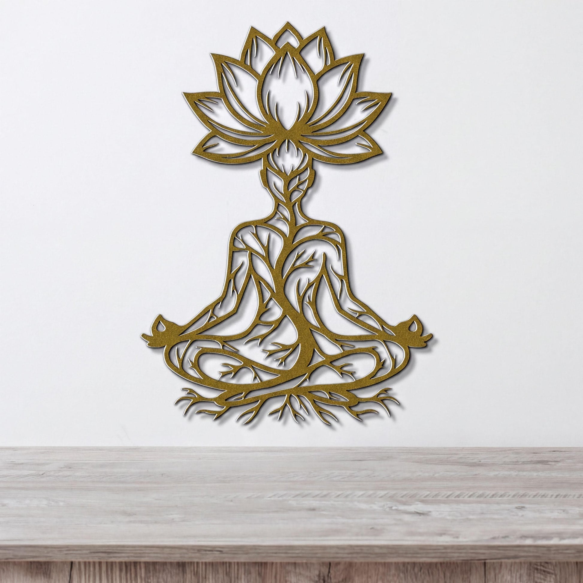 A wall art piece depicting a stylized figure in a meditative pose, with intricate tree-like patterns surrounding it.