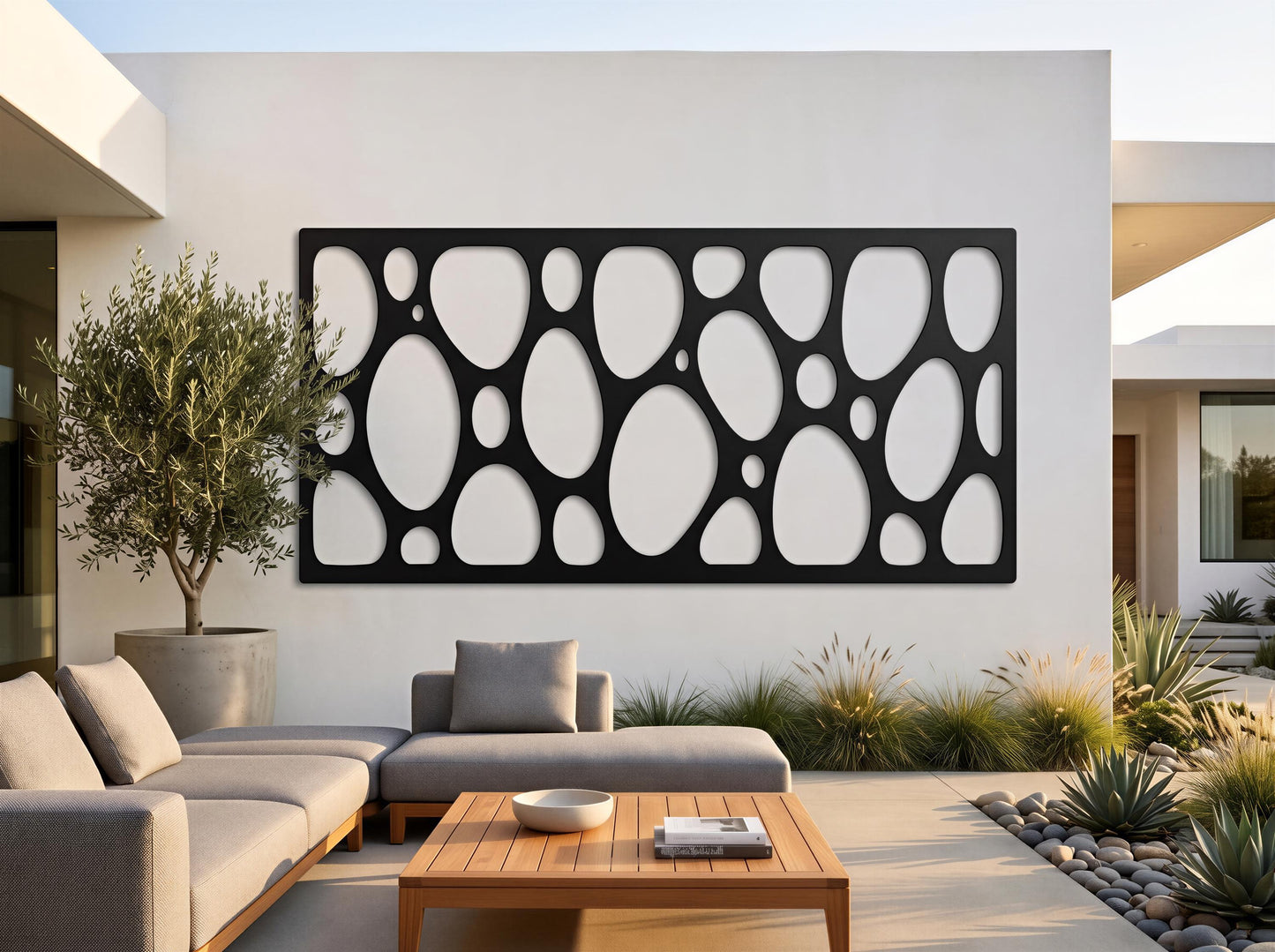 a modern outdoor living space with a large black circular wall art piece, a wooden coffee table, and comfortable seating arrangements.