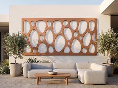 a modern outdoor living space with a white sofa, a wooden coffee table, and two potted plants. The sofa is positioned in front of a wall with a unique circular pattern, creating a visually appealing focal point.