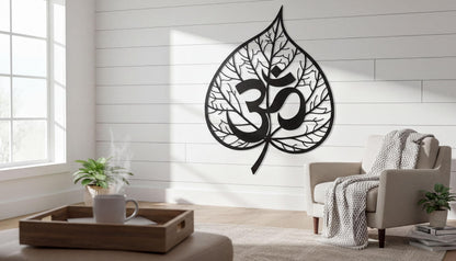 a living room with a large wall decal of a leaf-shaped Om symbol, a popular symbol in Hinduism and yoga. The room has a wooden coffee table, a comfortable chair, and a potted plant, creating a cozy and inviting atmosphere.