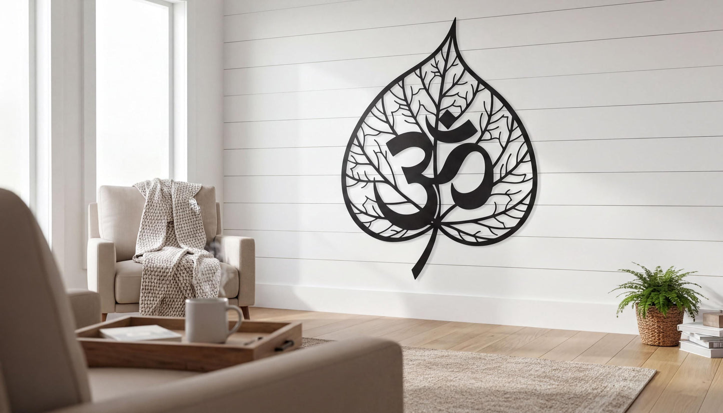 a living room with a large wall art piece depicting a leaf with the Om symbol, which is a common symbol in Hinduism and yoga. The room is furnished with a couch, chair, and a coffee table. There is also a potted plant and a tray with a coffee cup on the table.