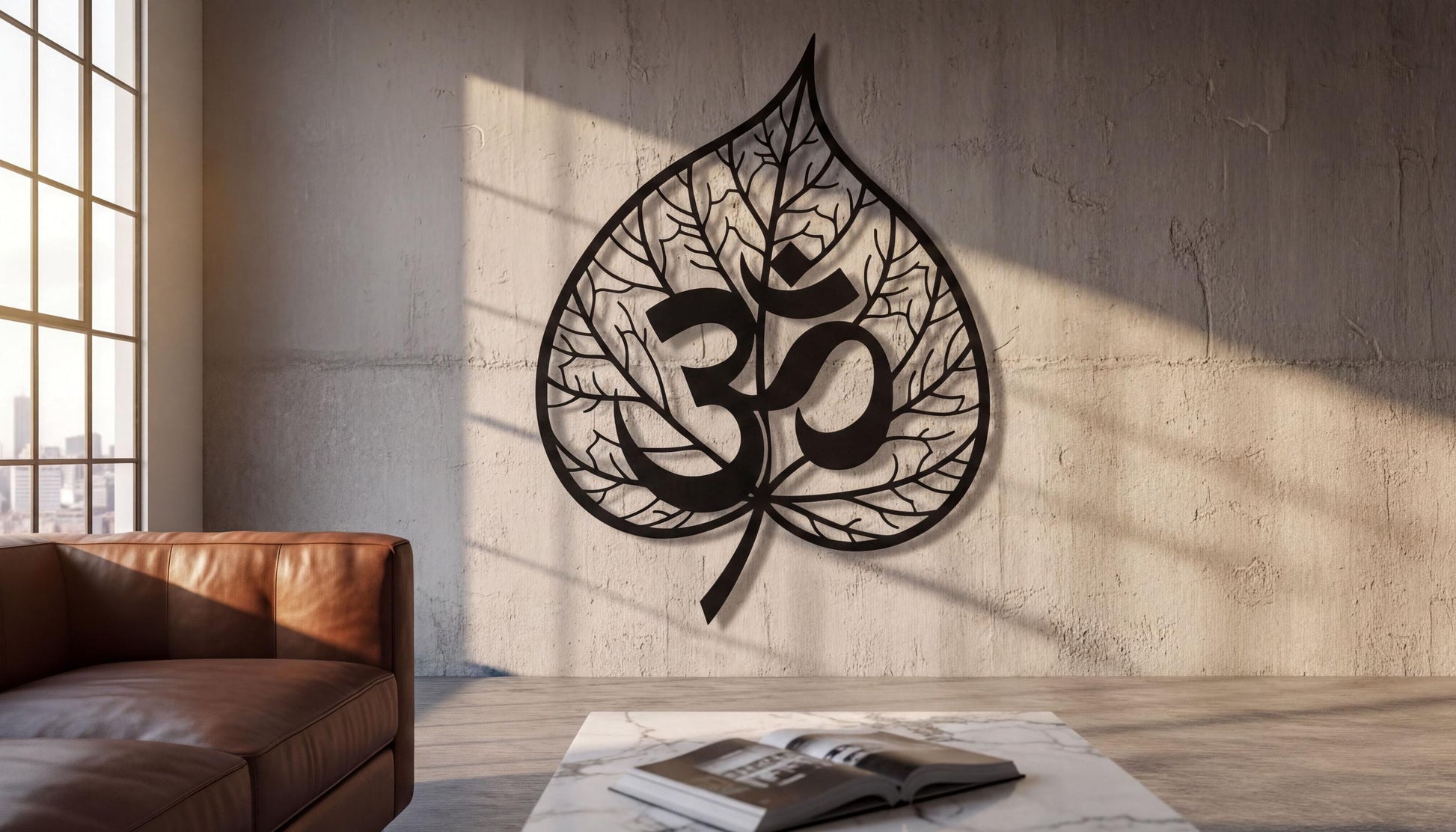 a large leaf-shaped metal sculpture with the Om symbol on it, mounted on a concrete wall in a living room setting.