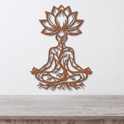 A wall art piece depicting a stylized figure in a meditative pose, with intricate tree-like patterns surrounding it.