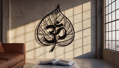 a wall with a large leaf-shaped metal sculpture displaying the Om symbol, which is a significant symbol in Hinduism and yoga.
