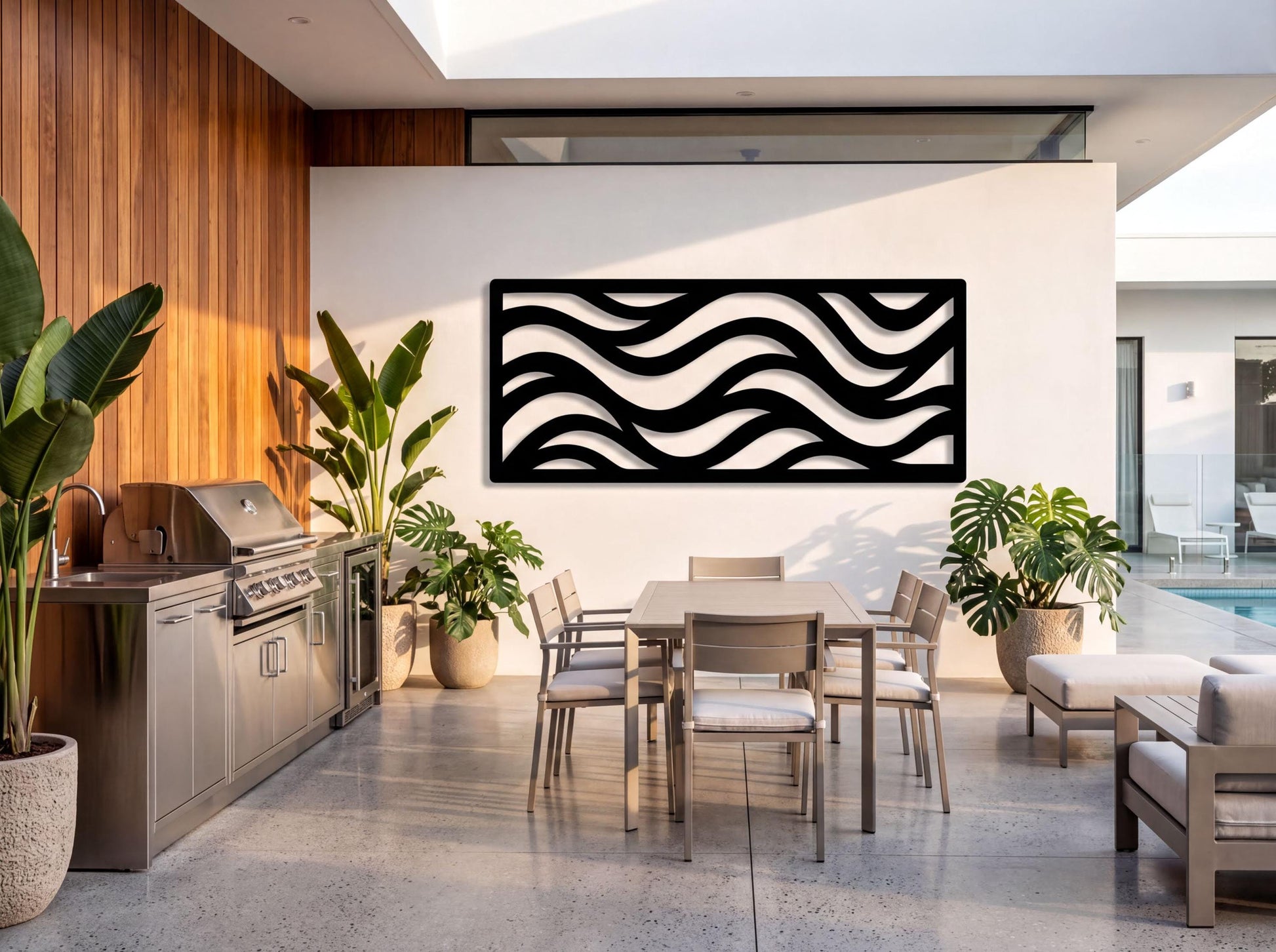 a modern outdoor dining area with a sleek, minimalist design. The space includes a large dining table surrounded by six chairs, with a large potted plant on the left side and a large potted plant on the right side. The wall behind the table features a striking black and white wave-like pattern, adding a unique visual element to the space. The overall design creates a harmonious and contemporary atmosphere.